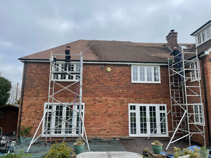 Roof cleaning carried out safely from scaffold towers by The Roof Moss Cleaners in Sawston